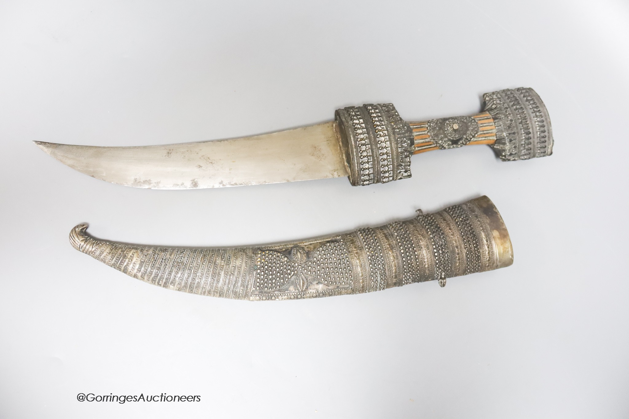 A Middle Eastern silver mounted dagger, length 51cm
